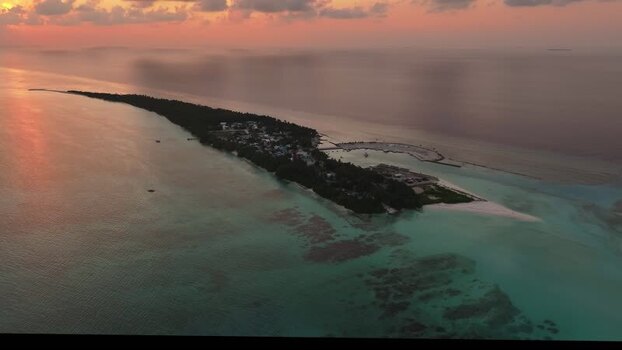 Aerial view of Fulhadhoo island at sunset Maldives.