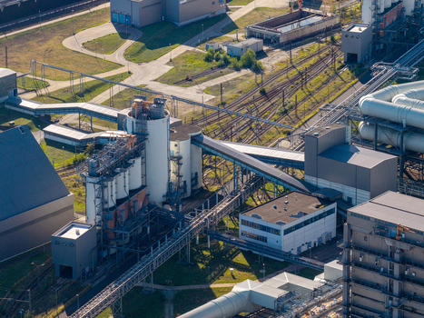 Aerial view of Janschwalde Power Station an industrial facility with silos pipelines and railway tracks undergoing a transition from coal based energy in Peitz Brandenburg Germany. Aerial view of Janschwalde Power Station an industrial facility with silos pipelines and railway tracks undergoing a transition from coal based energy in Peitz Brandenburg Germany.