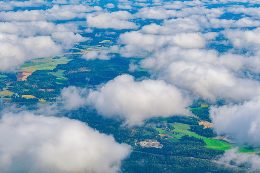 View of the lush green forests and agricultural fields of the Finnish countryside near Helsinki Uusimaa Finland.