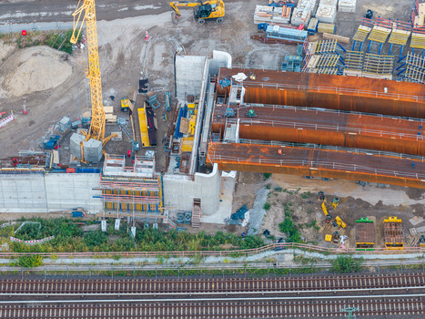 Aerial view of the Ringbahnbrucke bridge construction at the Funkturm interchange with a yellow crane steel girders and concrete abutments in Berlin Berlin Germany. Aerial view of the Ringbahnbrucke bridge construction at the Funkturm interchange with a yellow crane steel girders and concrete abutments in Berlin Berlin Germany.