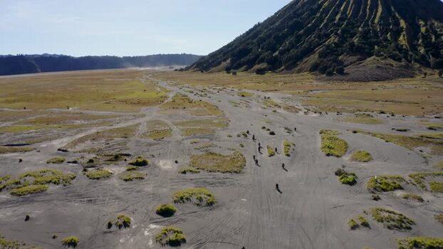 Aerial view of Mount Bromo volcanic slopes and sandy plains Indonesia. Aerial view of Mount Bromo volcanic slopes and sandy plains Indonesia.