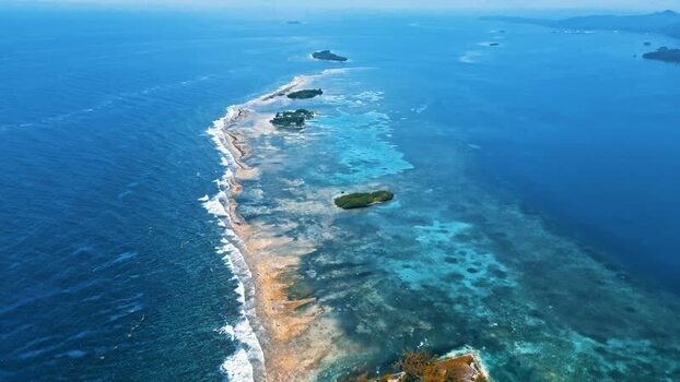 Aerial view of the coral reef and small cays in the Caribbean Sea Honduras. Aerial view of the coral reef and small cays in the Caribbean Sea Honduras.