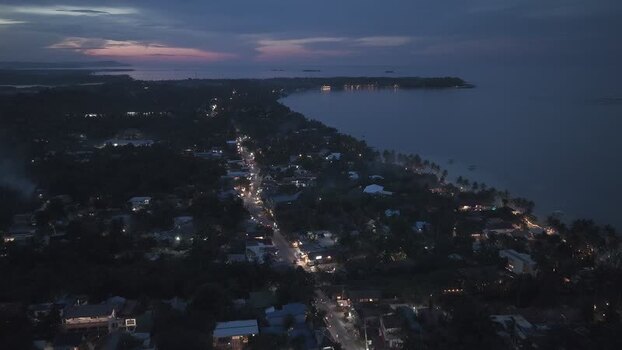 Aerial view of coastal town at night Philippines.