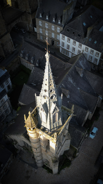 Aerial view of Eglise Saint Melaine de Morlaix with its gothic spire and surrounding historic stone houses in Morlaix Bretagne France. Aerial view of Eglise Saint Melaine de Morlaix with its gothic spire and surrounding historic stone houses in Morlaix Bretagne France.