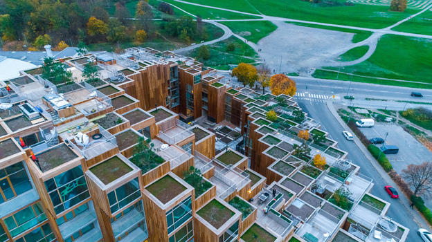 Aerial view of the 79Park residential building with wooden facades and terraced green roofs in Stockholm Sweden. Aerial view of the 79Park residential building with wooden facades and terraced green roofs in Stockholm Sweden.
