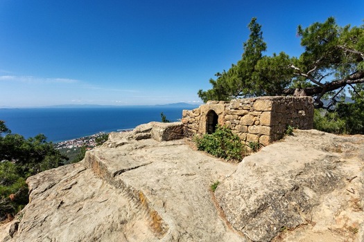 View of the historic Altar of Zeus stone structure on a rocky cliff overlooking the Aegean Sea in Adatepe Canakkale Turkey. View of the historic Altar of Zeus stone structure on a rocky cliff overlooking the Aegean Sea in Adatepe Canakkale Turkey.