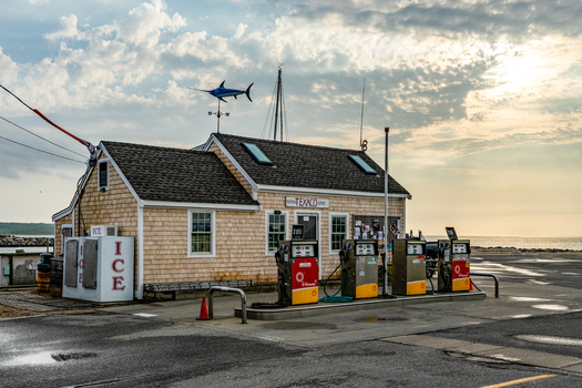 Edgartown United States 14 May 2026 View of Martha s Vineyard shingle style Texaco marine service station with a swordfish weather vane and gas pumps under a cloudy sky.