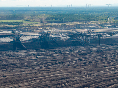 Aerial view of Tagebau Welzow Sud brown coal open pit mine with massive bucket wheel excavators extracting coal from the dark earth Spremberg Brandenburg Germany. Aerial view of Tagebau Welzow Sud brown coal open pit mine with massive bucket wheel excavators extracting coal from the dark earth Spremberg Brandenburg Germany.