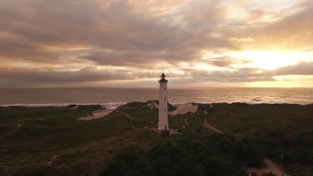 Aerial view of Lyngvig Lighthouse at sunset in Denmark.