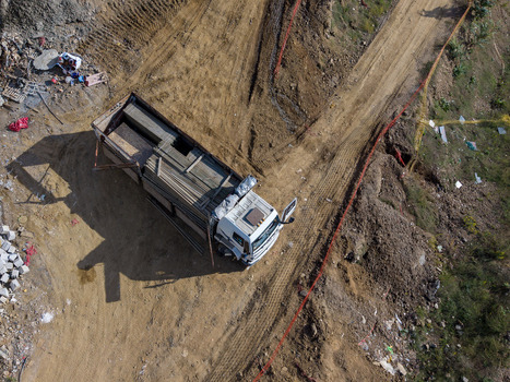 Aerial view of a white truck loaded with construction materials parked on a dirt road at a construction site in Istanbul Istanbul Turkiye.