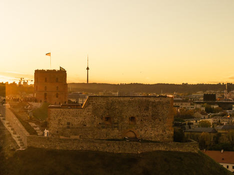 Aerial view of Gediminas Tower and the remains of the Upper Castle bathed in the warm glow of sunset Vilnius Lithuania. Aerial view of Gediminas Tower and the remains of the Upper Castle bathed in the warm glow of sunset Vilnius Lithuania.