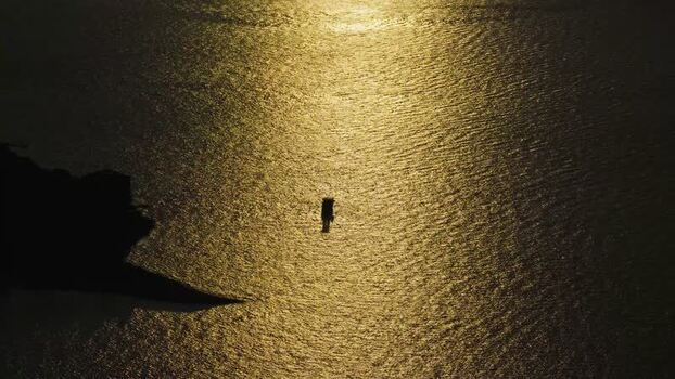Aerial view of boat on golden water near Brijuni Croatia.