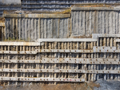 Aerial view of a reinforced concrete retaining wall with soil nails and structural beams at a construction site in Istanbul Istanbul Turkiye. Aerial view of a reinforced concrete retaining wall with soil nails and structural beams at a construction site in Istanbul Istanbul Turkiye.