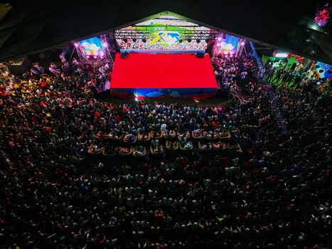Dhaka Bangladesh 20 July 2026 Aerial view of Mohsin Hall Playground with a large red stage and a massive crowd of spectators gathered for an evening event under bright lights. Dhaka Bangladesh 20 July 2026 Aerial view of Mohsin Hall Playground with a large red stage and a massive crowd of spectators gathered for an evening event under bright lights.