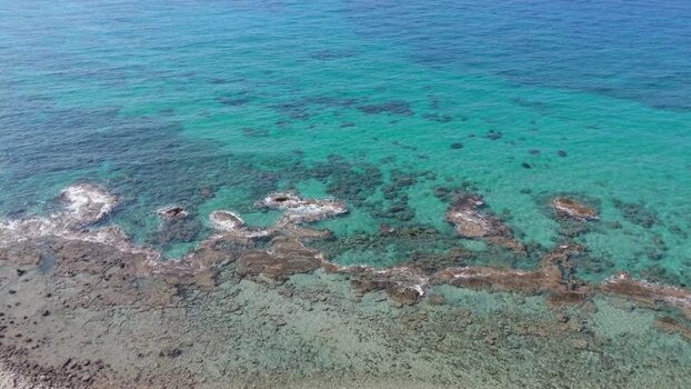 Aerial view of rocky coastline and turquoise water Northern Cyprus.