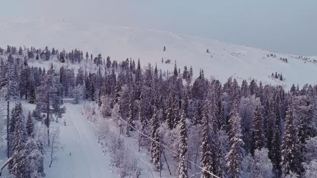 Aerial view of snowy forests and hills in Luosto Finland. Aerial view of snowy forests and hills in Luosto Finland.