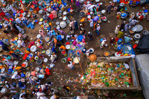 Tongi Bangladesh 31 January 2025 Aerial view of Tongi Ijtema Maidan with many people cooking meals in large pots and preparing food for the gathering.