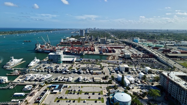 Aerial view of Riviera Beach Marina Village with luxury yachts the Port of Palm Beach cargo terminal and the Blue Heron Boulevard bridge in Riviera Beach Florida United States. Aerial view of Riviera Beach Marina Village with luxury yachts the Port of Palm Beach cargo terminal and the Blue Heron Boulevard bridge in Riviera Beach Florida United States.