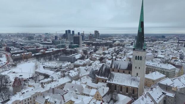 Aerial view of St. Olaf s Church in snowy Tallinn Estonia.