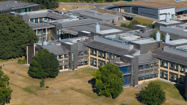 Aerial view of the Wellcome Genome Campus featuring modern research buildings expansive green lawns and mature trees in Hinxton England United Kingdom. Aerial view of the Wellcome Genome Campus featuring modern research buildings expansive green lawns and mature trees in Hinxton England United Kingdom.