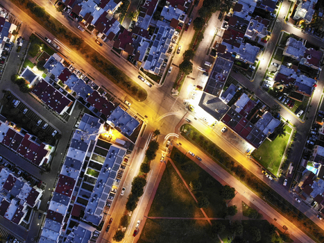 Aerial view of a residential neighborhood at night with illuminated streets streetlights and parked cars in Tlaquepaque Jalisco Mexico. Aerial view of a residential neighborhood at night with illuminated streets streetlights and parked cars in Tlaquepaque Jalisco Mexico.
