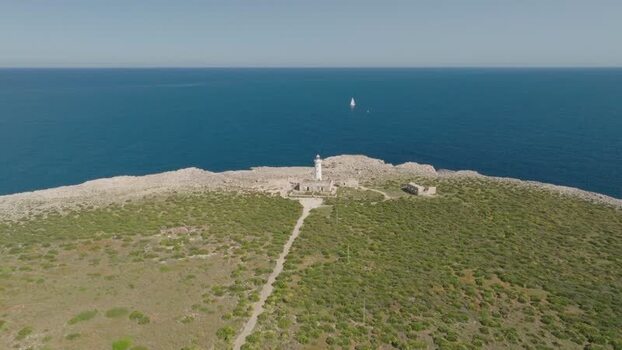 Aerial view of the Plemmirio lighthouse on the rocky coast Italy.
