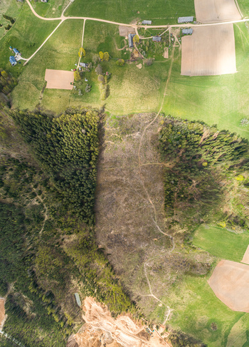 Aerial view of a rural landscape with agricultural fields farm buildings and forest patches in Latvia. Aerial view of a rural landscape with agricultural fields farm buildings and forest patches in Latvia.