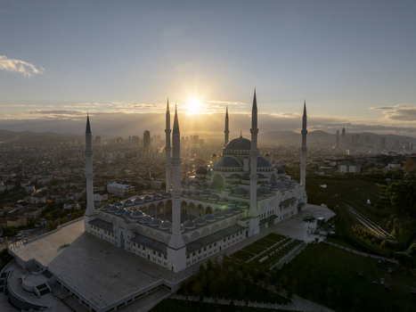 Aerial view of Grand Camlica Mosque at sunset with its grand domes and minarets overlooking the sprawling city skyline in Uskudar Istanbul Turkiye. Aerial view of Grand Camlica Mosque at sunset with its grand domes and minarets overlooking the sprawling city skyline in Uskudar Istanbul Turkiye.