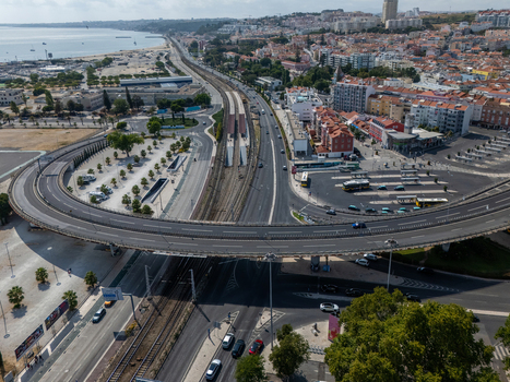 Aerial view of the highway interchange and railway tracks in the urban landscape of Alges Lisbon Portugal.