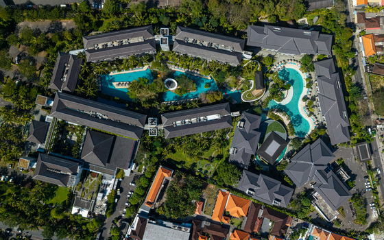 Aerial view of Marriott s Bali Nusa Dua Gardens featuring swimming pools lush tropical gardens and resort buildings in Kecamatan Kuta Selatan Bali Indonesia.