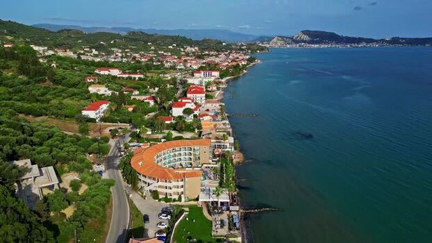 Aerial view of coastal resort and hotel in Greece.