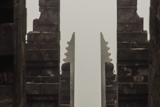 View of the ancient stone gates of Cetho Temple shrouded in thick mist Kecamatan Jenawi Jawa Tengah Indonesia. View of the ancient stone gates of Cetho Temple shrouded in thick mist Kecamatan Jenawi Jawa Tengah Indonesia.
