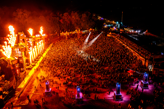 Herzogenaurach Germany 27 July 2025 Aerial view of Open Beatz Festival with a massive crowd pyrotechnics and vibrant stage lighting at night. Herzogenaurach Germany 27 July 2025 Aerial view of Open Beatz Festival with a massive crowd pyrotechnics and vibrant stage lighting at night.