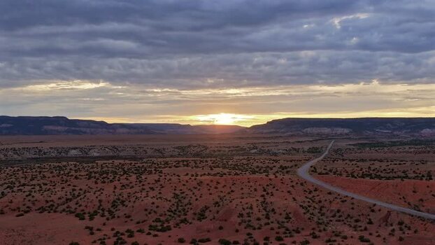 Aerial view of highway in desert landscape at sunset United States.