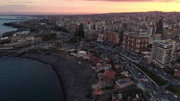 Aerial view of the coastal skyline and traffic at sunset Italy. Aerial view of the coastal skyline and traffic at sunset Italy.