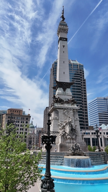 Aerial view of Soldiers and Sailors Monument with a tiered fountain and surrounding urban skyscrapers in Indianapolis USA. Aerial view of Soldiers and Sailors Monument with a tiered fountain and surrounding urban skyscrapers in Indianapolis USA.