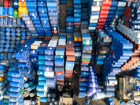 Aerial view of thousands of colorful metal barrels stacked in rows at an industrial storage facility in Dhaka Dhaka Division Bangladesh. Aerial view of thousands of colorful metal barrels stacked in rows at an industrial storage facility in Dhaka Dhaka Division Bangladesh.