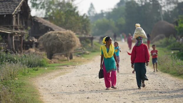 View of people walking on a rural road in Dhangadhi Nepal. View of people walking on a rural road in Dhangadhi Nepal.
