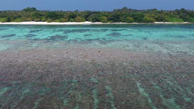 Aerial view of Vaikaradhoo island and coral reef Maldives. Aerial view of Vaikaradhoo island and coral reef Maldives.