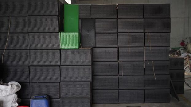 View of stacked black plastic crates in a warehouse Bangladesh. View of stacked black plastic crates in a warehouse Bangladesh.