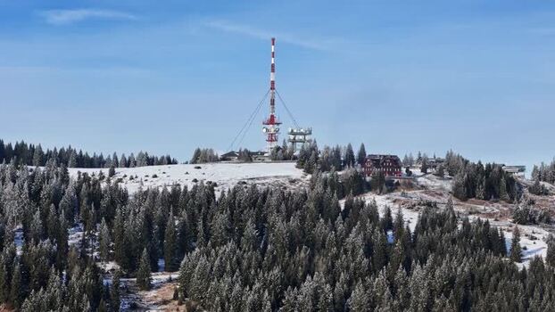 Aerial view of the Schockl transmitter tower and snowy peak Austria. Aerial view of the Schockl transmitter tower and snowy peak Austria.