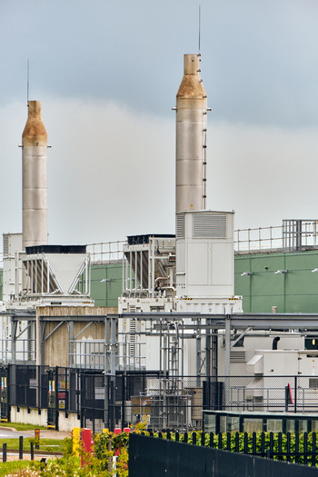 Middenmeer Netherlands 17 May 2026 View of Microsoft datacenters western europe on Agriport along the A7 with tall industrial exhaust stacks and metal infrastructure.