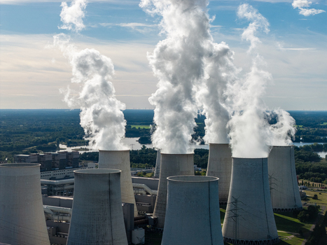 Aerial view of the Janschwalde Power Station with large cooling towers emitting steam over the industrial landscape in Peitz Brandenburg Germany. Aerial view of the Janschwalde Power Station with large cooling towers emitting steam over the industrial landscape in Peitz Brandenburg Germany.