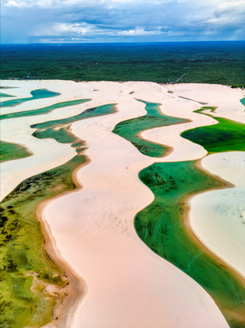 Aerial view of Lagoa Bonita featuring white sand dunes and turquoise lagoons in Barreirinhas State of Maranhao Brazil. Aerial view of Lagoa Bonita featuring white sand dunes and turquoise lagoons in Barreirinhas State of Maranhao Brazil.
