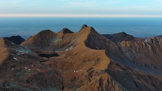 Aerial view of Transfagarasan mountain peaks in Romania. Aerial view of Transfagarasan mountain peaks in Romania.