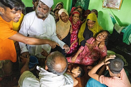 Banshkhali Upazila Bangladesh 10 July 2026 View of a grieving family gathered around a loved one in a room with green walls capturing a moment of deep sorrow and emotional distress. Banshkhali Upazila Bangladesh 10 July 2026 View of a grieving family gathered around a loved one in a room with green walls capturing a moment of deep sorrow and emotional distress.