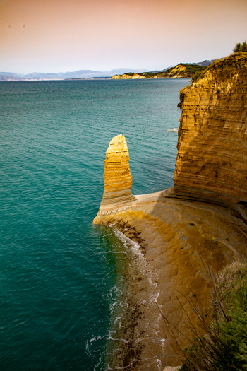 Aerial view of the unique sandstone rock formations and sea cliffs of Canal d Amour with turquoise waters and clear sky in Corfu Ionian Islands Greece. Aerial view of the unique sandstone rock formations and sea cliffs of Canal d Amour with turquoise waters and clear sky in Corfu Ionian Islands Greece.