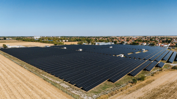 Aerial view of a large solar farm with rows of photovoltaic panels situated in a rural landscape near the town of Temerin Vojvodina Serbia. Aerial view of a large solar farm with rows of photovoltaic panels situated in a rural landscape near the town of Temerin Vojvodina Serbia.