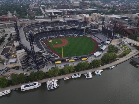 Pittsburgh Pennsylvania United States 26 July 2026 Aerial view of PNC Park baseball stadium along the Allegheny River with docked boats and the city skyline.