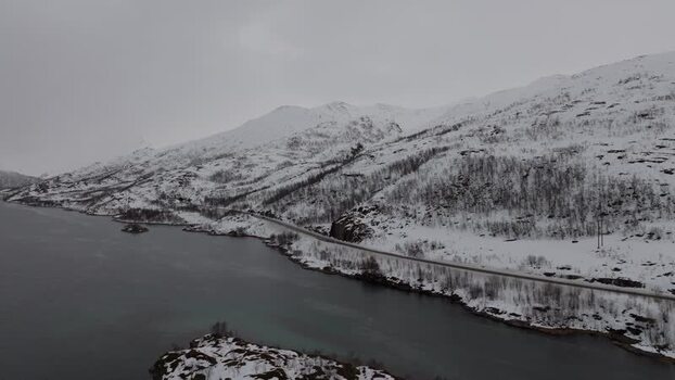 Aerial view of snowy Lofoten mountains in Norway.